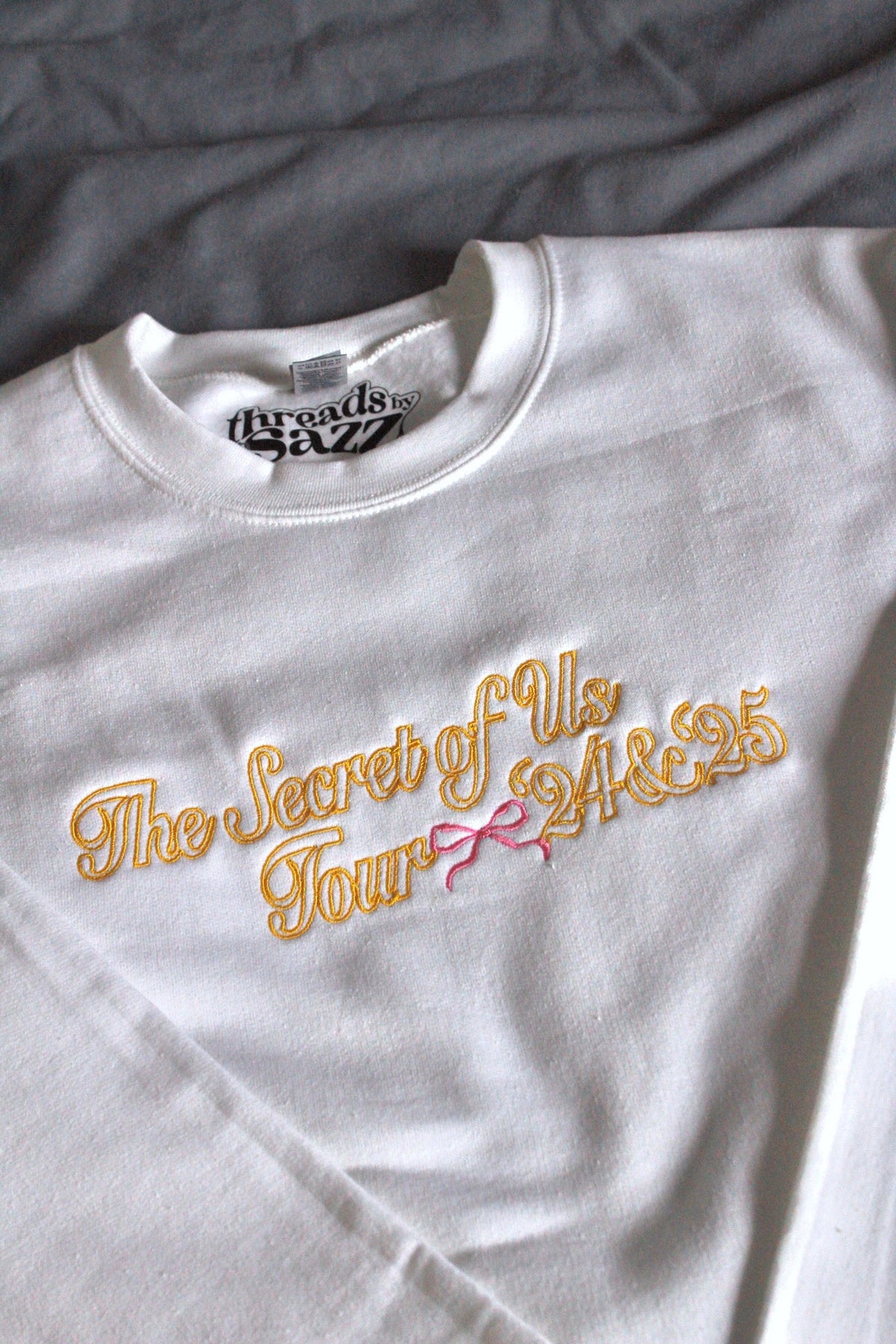tsou tour · embroidered crewneck