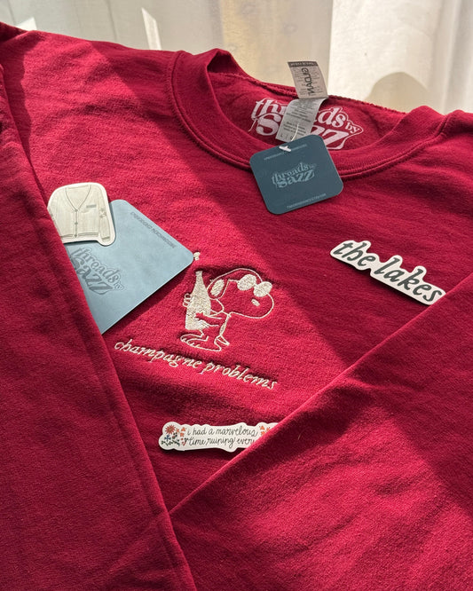 "champagne problems" & snoopy · embroidered crewneck